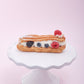 Eclair de frutos rojos